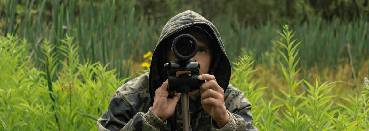 A birdwatcher using a spotting scope.